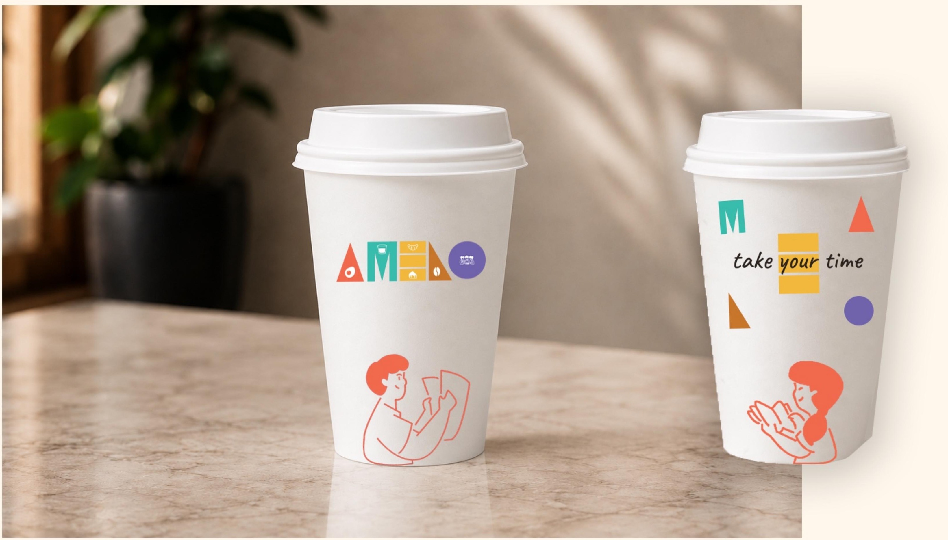 Two Amelo to-go coffee cups, one with the full logo and icons, one with scattered shapes and the take your time slogan